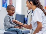 a nurse in a consult with a child in a hospital