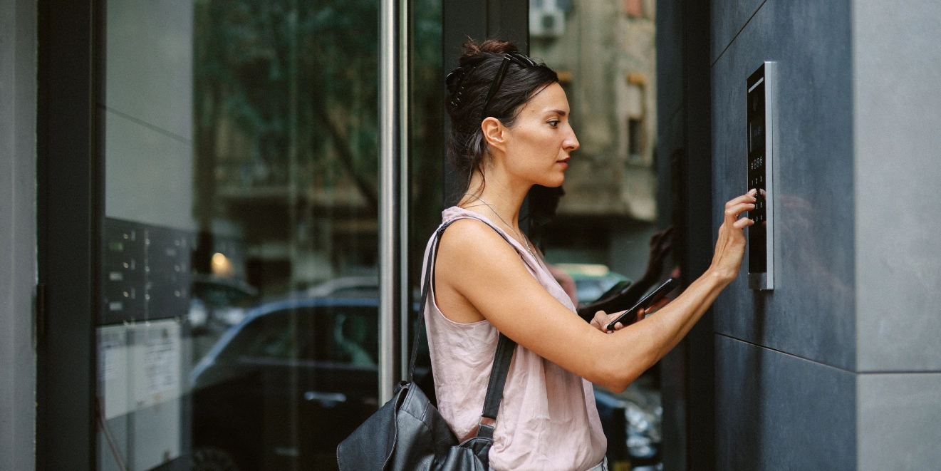 Photo of a person using a visitor management system