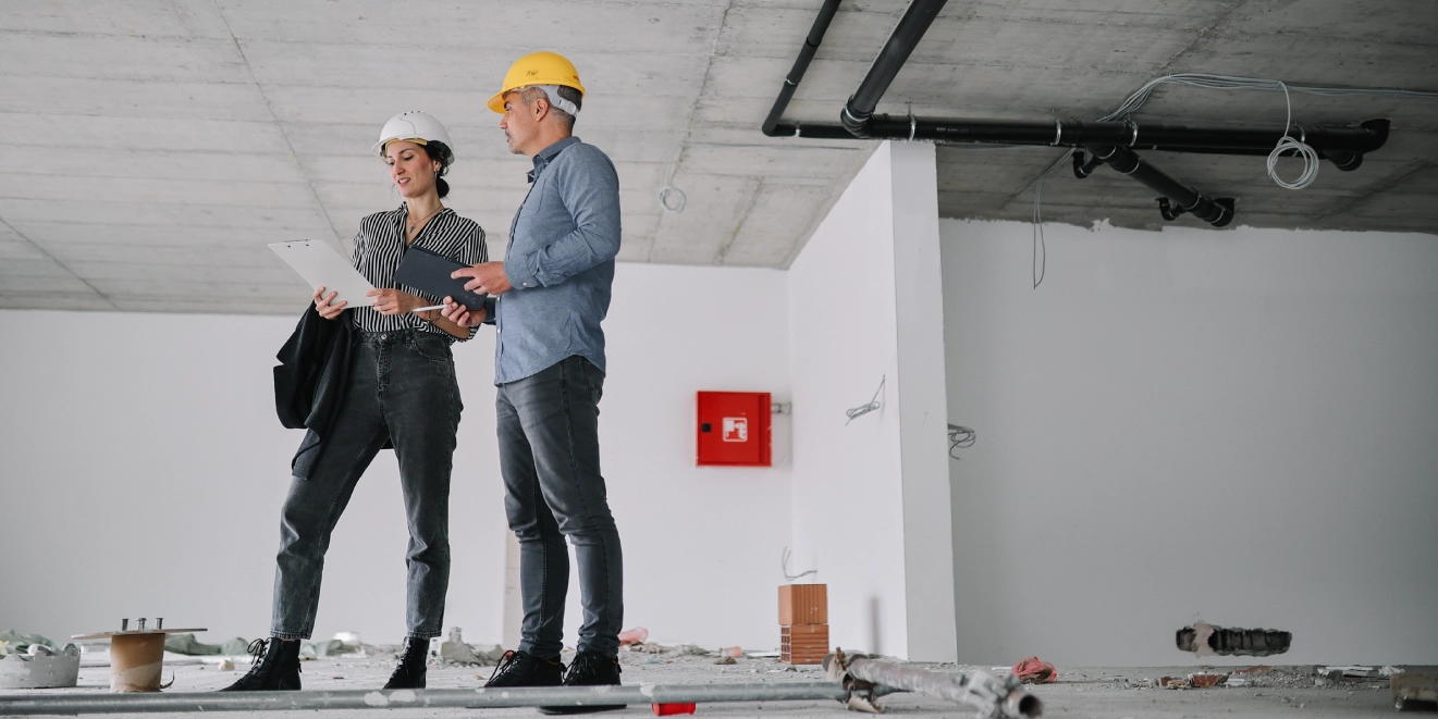 Two people at construction site