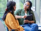 a staff member talking to a patient in a behavioral health facility