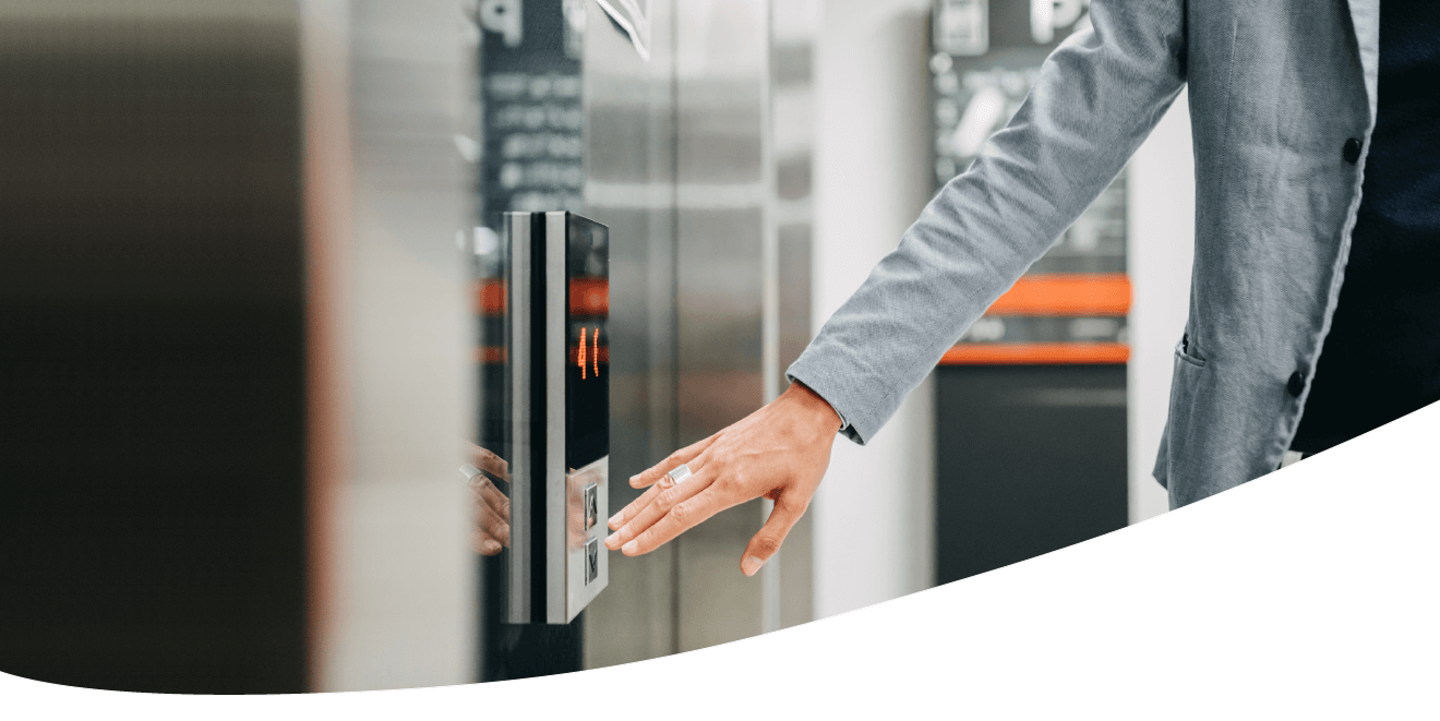 Woman pressing an elevator button